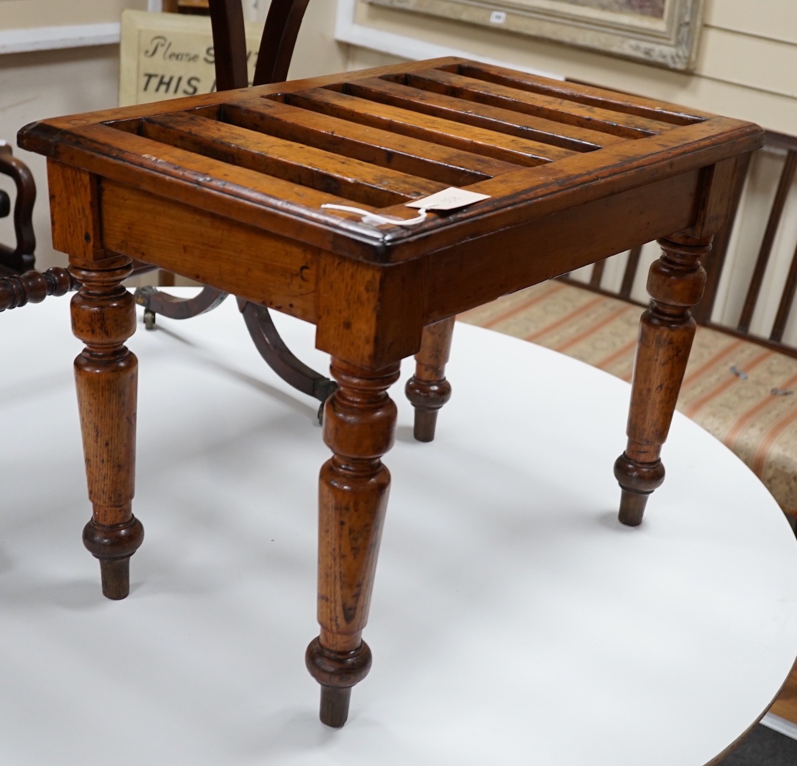 An Edwardian oak and beech luggage rack, width 60cm *Please note the sale commences at 9am.